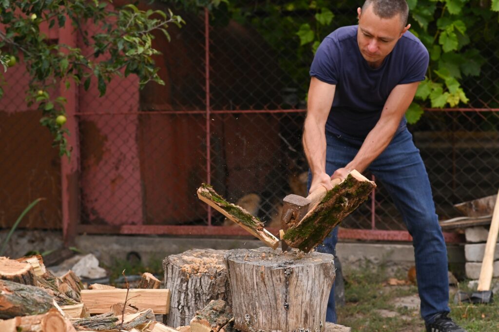The man split the log with an axe.